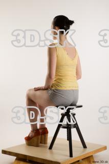 Sitting reference of whole body yellow t shirt gray shorts…